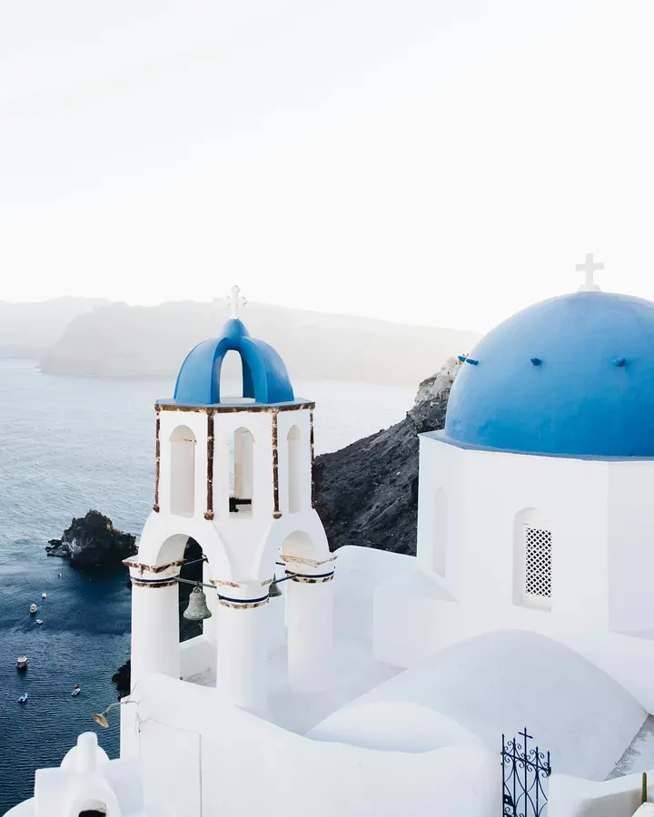 White houses and blue domes above the sea on Santorini